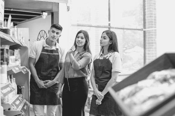 A retail store manager working with her associates.