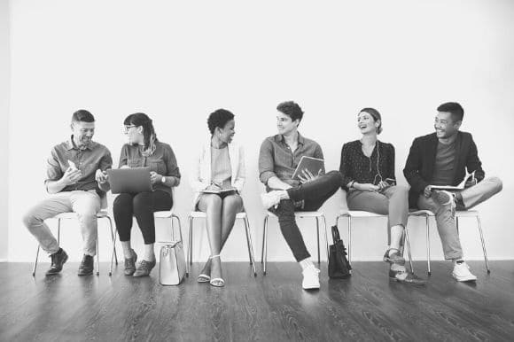 A line of job candidates waiting to be interviewed.