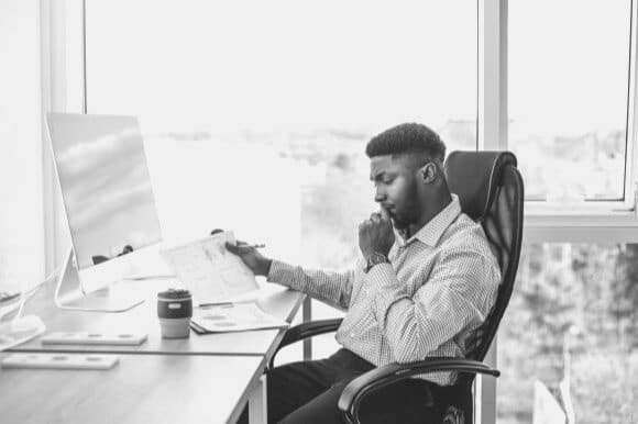 Financial accountant reviewing budget data in office
