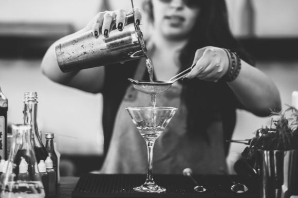 Bartender pouring drinks at work
