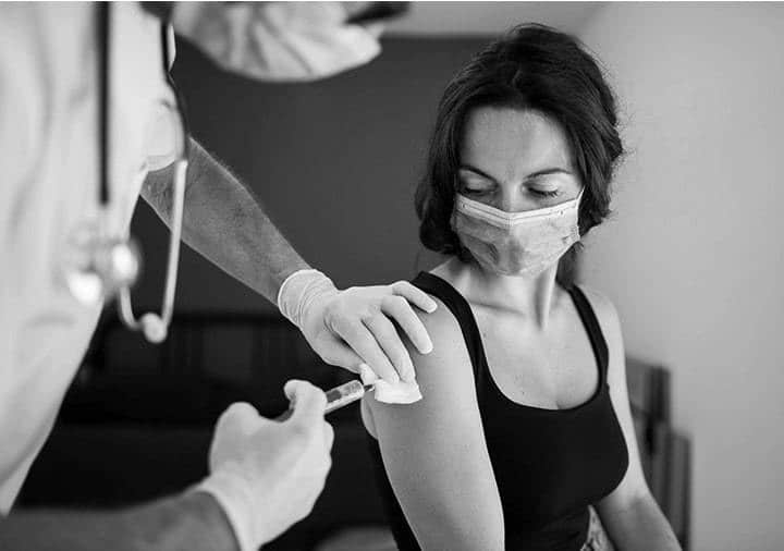woman receiving vaccination