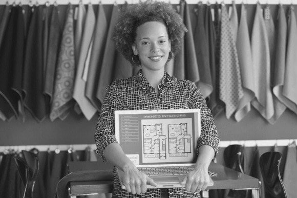 interior designer holding laptop