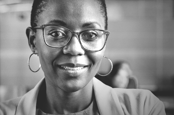 Woman smiling at camera in an office