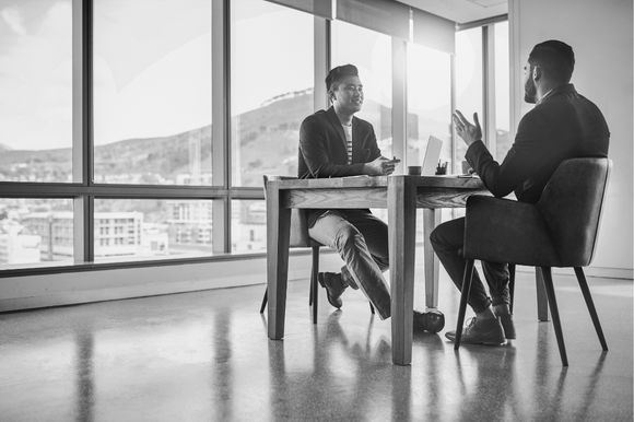 A hiring manager interviews a candidate.